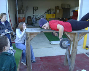 Anna! Doing her thing While coach Sarah, alumni Becky, and rower Megan watch the machine at work
