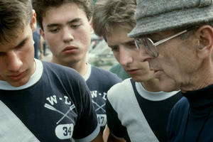 1986 - Eric Gaaserud, Charlie Fox, and Derek Parsons going over the race schedule with Charlie Butt. 